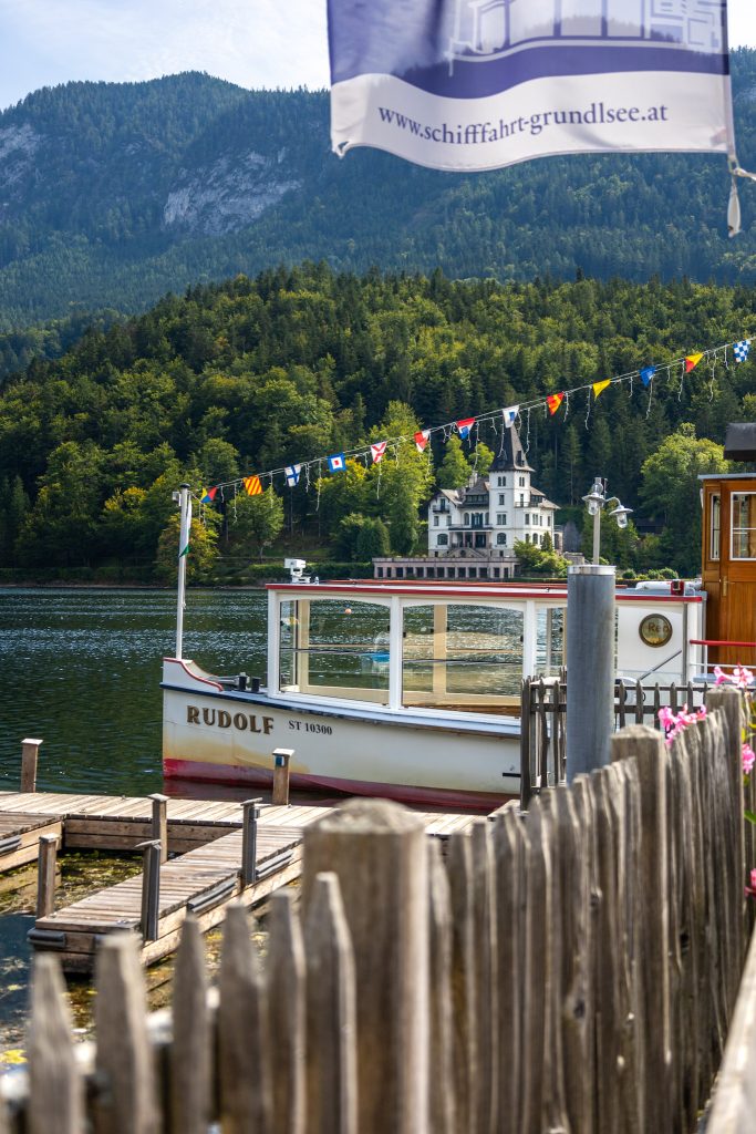 Nostalgic boat at Lake Grundlsee in Ausseerland in Styria, Austria, with mountain backdrop.